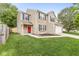Charming two-story home with a red front door, attached garage, and well-maintained lawn at 3803 Churchman Woods Blvd, Indianapolis, IN 46203