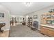 Expansive living space with cozy seating, connecting dining area, creating a warm and inviting ambiance at 3803 Churchman Woods Blvd, Indianapolis, IN 46203