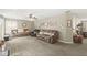 Spacious living room featuring neutral walls, plush carpeting and plenty of seating at 3803 Churchman Woods Blvd, Indianapolis, IN 46203