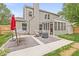 Relaxing patio area with a hammock, comfortable seating, fire pit, and screened in porch at 3803 Churchman Woods Blvd, Indianapolis, IN 46203