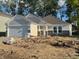 Charming single-Gathering home with attached garage, stone accents, and an inviting front porch at 3805 Windstar Way, Columbus, IN 47203