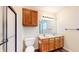 This bathroom has a wooden vanity with double sinks, a toilet, and a shower stall at 3916 Jekyll Ct, Indianapolis, IN 46237