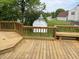 A wooden deck with railings, bench, and backyard views is perfect for enjoying the outdoors and neighborhood scenery at 3916 Jekyll Ct, Indianapolis, IN 46237