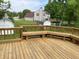A wooden deck with railings, bench, and backyard views with shed offers a great spot for relaxation and outdoor enjoyment at 3916 Jekyll Ct, Indianapolis, IN 46237