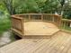 A wooden octagonal deck surrounded by green trees offers a great space for outdoor relaxation and entertainment at 3916 Jekyll Ct, Indianapolis, IN 46237
