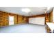 Large garage with exposed insulation, a work bench, and a two-car garage door at 3916 Jekyll Ct, Indianapolis, IN 46237