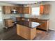Spacious kitchen with a large island, stainless steel appliances, and granite countertops at 3916 Jekyll Ct, Indianapolis, IN 46237