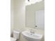 Modern bathroom with a pedestal sink and large mirror at 3927 Wren Dr, Brownsburg, IN 46112