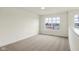 Well-lit bedroom with carpet flooring and a large window at 3927 Wren Dr, Brownsburg, IN 46112
