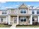 Inviting two-story home with a covered front porch, stone accents, and manicured landscaping at 3927 Wren Dr, Brownsburg, IN 46112