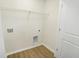 A laundry room with plank flooring and washer dryer hookups at 3927 Wren Dr, Brownsburg, IN 46112