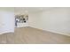 Spacious living room with hardwood floors, open to a modern kitchen with stainless appliances at 3927 Wren Dr, Brownsburg, IN 46112