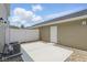 Private backyard with concrete patio, white fence, rock ground cover, and neutral colored siding at 3947 Wren Dr, Brownsburg, IN 46112