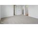 Neutral carpeted bedroom space featuring multiple entryways and bright natural light at 3947 Wren Dr, Brownsburg, IN 46112
