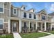 Charming townhome showcases stone accents and a well-maintained front yard at 3947 Wren Dr, Brownsburg, IN 46112
