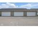 Exterior shot of garages with white doors and gray siding, and ample parking space at 3947 Wren Dr, Brownsburg, IN 46112