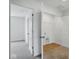 Hallway featuring multiple entryways to bedrooms and utility spaces, with neutral carpeting throughout at 3947 Wren Dr, Brownsburg, IN 46112