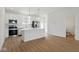 Contemporary kitchen with stainless steel appliances, an island, and hardwood floors at 3947 Wren Dr, Brownsburg, IN 46112