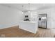 Modern kitchen featuring stainless steel appliances and a center island at 3947 Wren Dr, Brownsburg, IN 46112