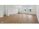 Bright living room featuring hardwood floors and abundant natural light at 3947 Wren Dr, Brownsburg, IN 46112