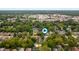High angle aerial view displays neighborhood homes near a large event ground with an open sky above at 4040 Carrollton Ave, Indianapolis, IN 46205