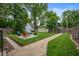 Backyard with patio, fire pit, and lush lawn is a perfect spot for relaxation and outdoor enjoyment at 4040 Carrollton Ave, Indianapolis, IN 46205