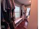 Walk-in closet with organized shelving and window bench seating at 4040 Carrollton Ave, Indianapolis, IN 46205