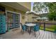 Charming deck with outdoor seating, perfect for entertaining, and direct access to the home through beautiful French doors at 4040 Carrollton Ave, Indianapolis, IN 46205