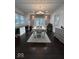 Dining room featuring hardwood floors, stylish furnishings, with views to the backyard at 4040 Carrollton Ave, Indianapolis, IN 46205