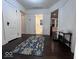 Inviting hallway with hardwood floors, white trim, and access to various rooms at 4040 Carrollton Ave, Indianapolis, IN 46205