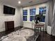 Bright home office with ample natural light, modern desk, and stylish decor at 4040 Carrollton Ave, Indianapolis, IN 46205
