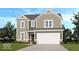 This is a charming two-story home with a two car garage, a combination of brick and vinyl siding, and manicured lawn at 438 Weaver Ln, Pittsboro, IN 46167