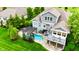 Aerial view of backyard featuring a pool, patio, pergola, and deck at 4420 Hickory Ridge Blvd, Greenwood, IN 46143