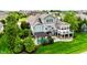 Aerial view of backyard with pool, patio, deck, and pergola at 4420 Hickory Ridge Blvd, Greenwood, IN 46143