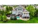 Aerial view of backyard with pool, patio, deck, and pergola at 4420 Hickory Ridge Blvd, Greenwood, IN 46143