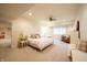 Bright bedroom featuring soft carpet, natural light, and a comfortable bed with coordinated decor at 4420 Hickory Ridge Blvd, Greenwood, IN 46143