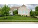 Charming single-Gathering home boasts a lush green lawn and meticulously maintained landscaping at 4420 Hickory Ridge Blvd, Greenwood, IN 46143