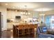 Well-lit kitchen features an island, pendant lighting, and stainless steel appliances at 4420 Hickory Ridge Blvd, Greenwood, IN 46143