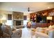 Cozy living room featuring a stone fireplace, built-in shelving, and plush seating at 4420 Hickory Ridge Blvd, Greenwood, IN 46143