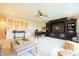 Spacious living room showcasing a ceiling fan, built-in shelving, and ample space for relaxation at 4420 Hickory Ridge Blvd, Greenwood, IN 46143