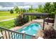 Aerial view of the backyard pool, pergola, hot tub, and surrounding landscape at 4420 Hickory Ridge Blvd, Greenwood, IN 46143