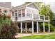 Enclosed porch with deck, swings, and landscaping for a relaxing outdoor retreat at 4420 Hickory Ridge Blvd, Greenwood, IN 46143