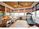 Sunroom featuring wood ceiling, multiple windows with shades, and a lounge area with exercise equipment at 4420 Hickory Ridge Blvd, Greenwood, IN 46143