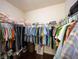 This large walk-in closet has hardwood floors and plenty of space to hang clothing at 4420 Hickory Ridge Blvd, Greenwood, IN 46143