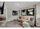 Cozy bonus living room space with stylish furnishings and mounted TV at 4460 Laughter Ln, Indianapolis, IN 46235