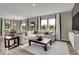 Inviting living room featuring a plush sectional, neutral tones, and abundant natural light at 4460 Laughter Ln, Indianapolis, IN 46235