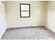 Empty bedroom with neutral walls, one window, and carpeted floor at 5130 Navajo Ct, Columbus, IN 47203