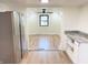 Bright kitchen view into open concept area with luxury vinyl plank flooring at 5130 Navajo Ct, Columbus, IN 47203