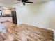 Open concept living room area with vinyl plank flooring and view into the kitchen at 5130 Navajo Ct, Columbus, IN 47203