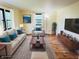 Staged living room area with modern decor and abundant natural light at 5130 Navajo Ct, Columbus, IN 47203